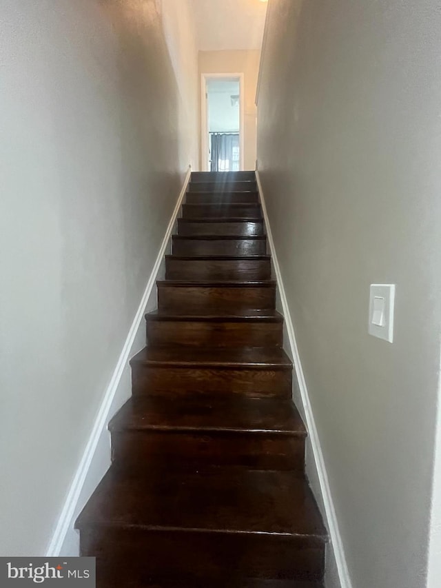 staircase with baseboards