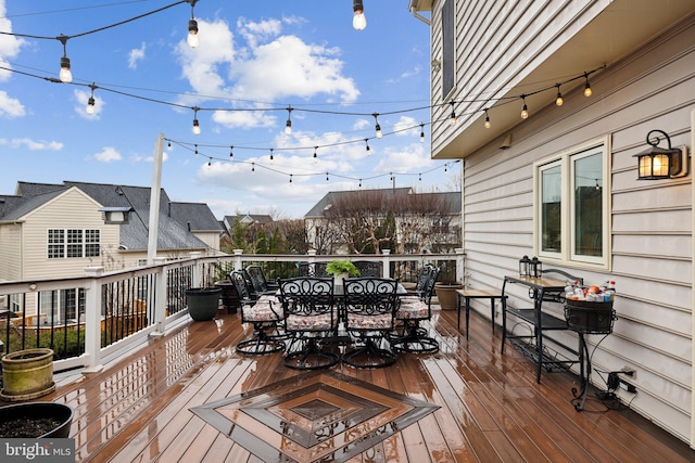 wooden terrace featuring outdoor dining area