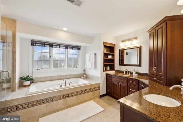 full bathroom with a garden tub, visible vents, vanity, a shower stall, and tile patterned flooring