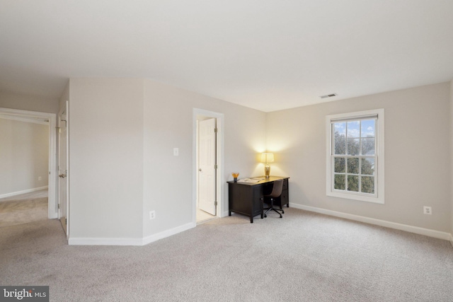 interior space featuring carpet, visible vents, and baseboards