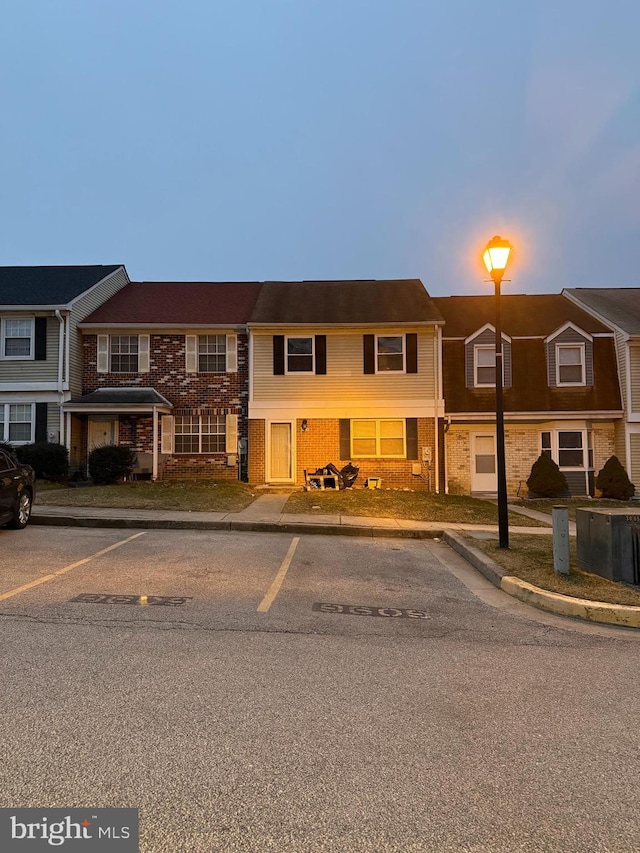 view of property with brick siding