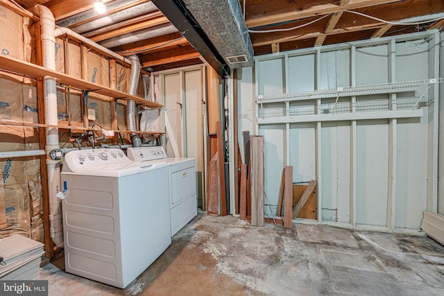 unfinished basement with washer and clothes dryer and visible vents