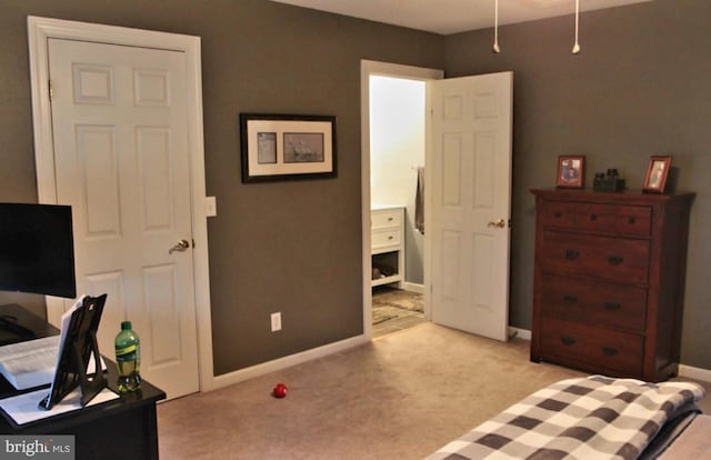 bedroom featuring light carpet and baseboards