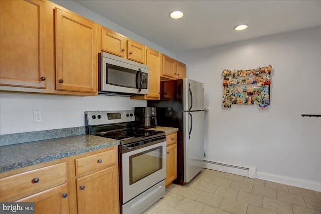 kitchen featuring baseboards, dark countertops, a baseboard radiator, stainless steel appliances, and recessed lighting