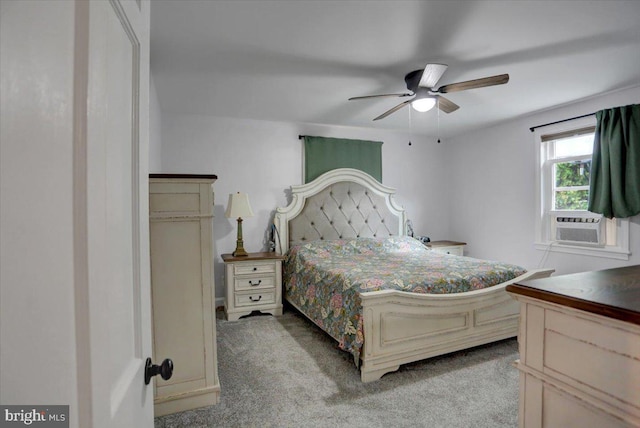 bedroom with light carpet, a ceiling fan, and cooling unit