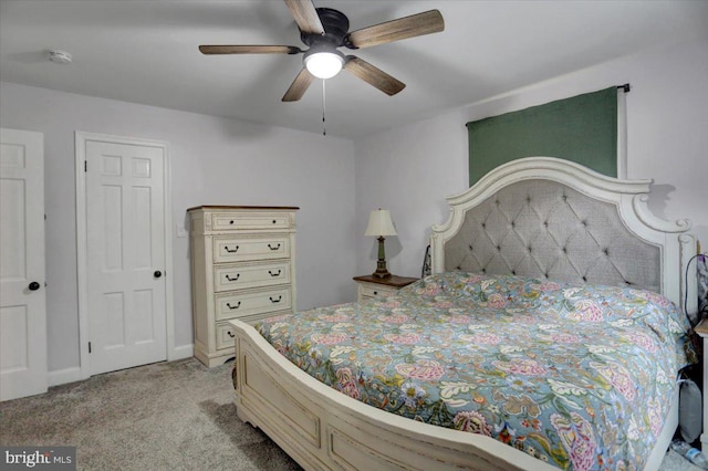 bedroom featuring a ceiling fan and light colored carpet