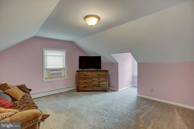 additional living space with cooling unit, a baseboard heating unit, carpet floors, baseboards, and vaulted ceiling