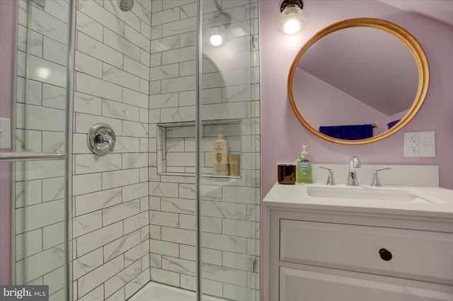 bathroom featuring a stall shower and vanity