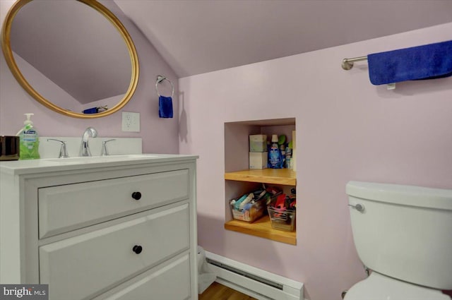 half bath with a baseboard heating unit, lofted ceiling, vanity, and toilet