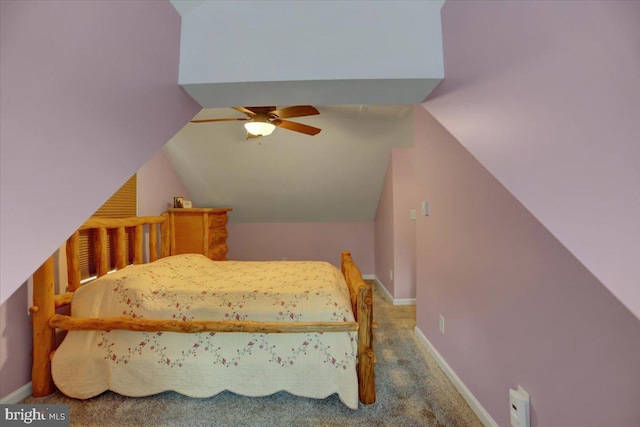 carpeted bedroom featuring lofted ceiling, ceiling fan, and baseboards