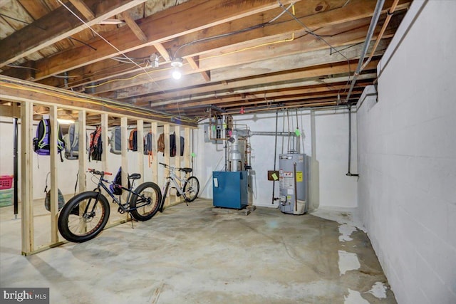 unfinished below grade area featuring water heater and a heating unit