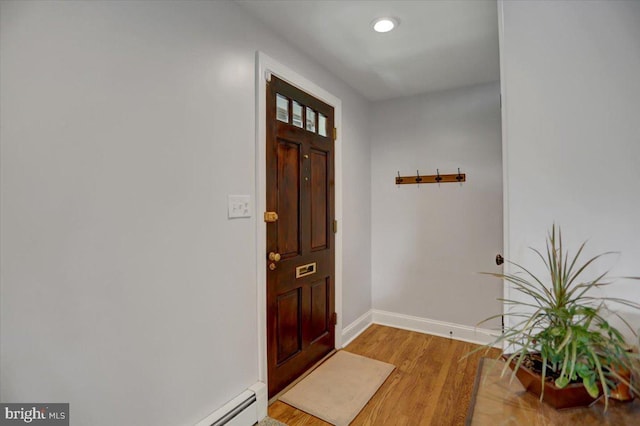 foyer entrance featuring recessed lighting, baseboards, and light wood finished floors