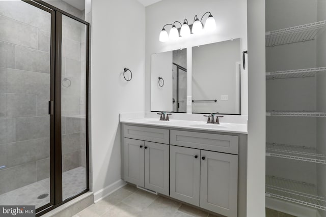 bathroom featuring a sink and a shower stall