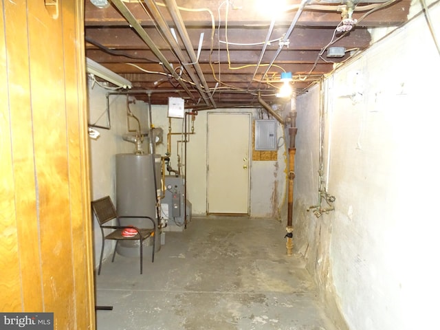 unfinished below grade area featuring a heating unit, electric panel, and water heater