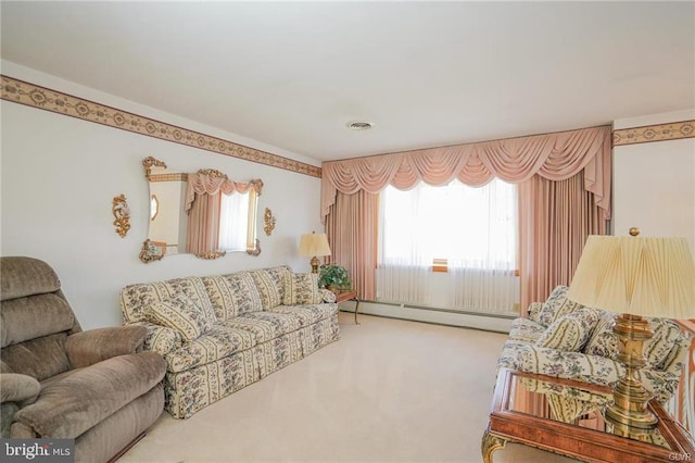 carpeted living room featuring plenty of natural light, visible vents, and a baseboard heating unit