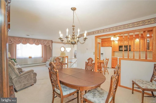 dining room with a chandelier and baseboard heating