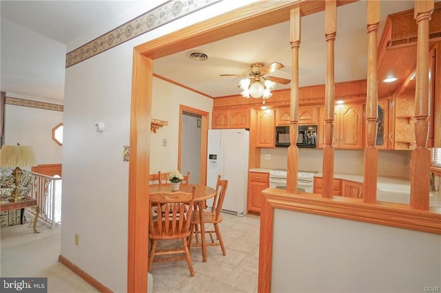 kitchen featuring visible vents, a ceiling fan, ornamental molding, white appliances, and baseboards