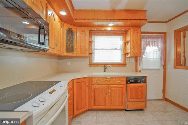 kitchen featuring white electric stove, light countertops, a sink, black microwave, and dishwasher