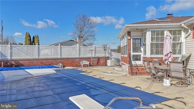 view of patio / terrace featuring fence