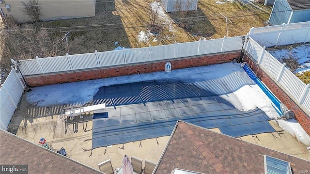 view of pool with a fenced backyard and a patio