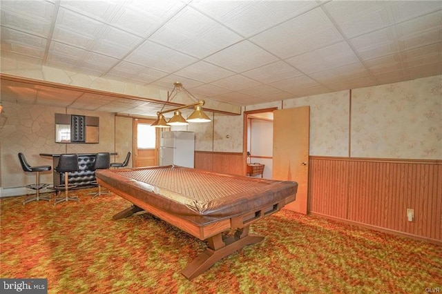 rec room featuring carpet floors, a wainscoted wall, billiards, and wooden walls