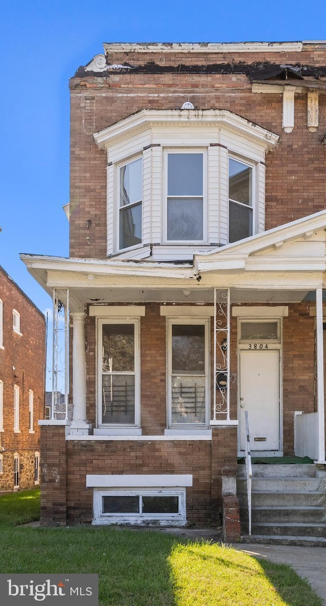 view of front of home featuring brick siding