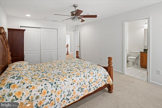 bedroom with visible vents, a ceiling fan, ensuite bath, a closet, and carpet floors