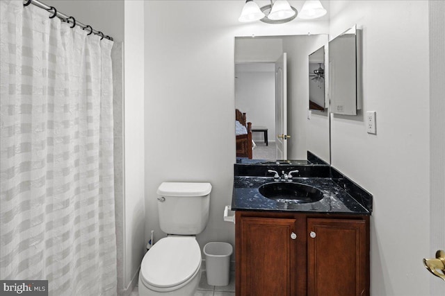 full bath with vanity, curtained shower, and toilet