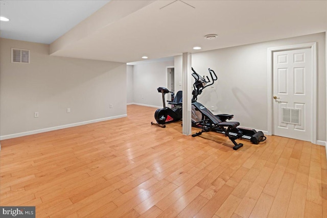 workout room with visible vents, recessed lighting, baseboards, and light wood-style floors