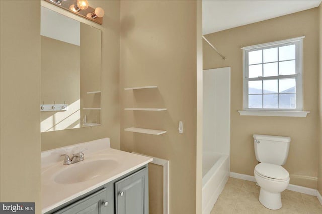 full bath with vanity, baseboards, shower / bath combination, tile patterned floors, and toilet