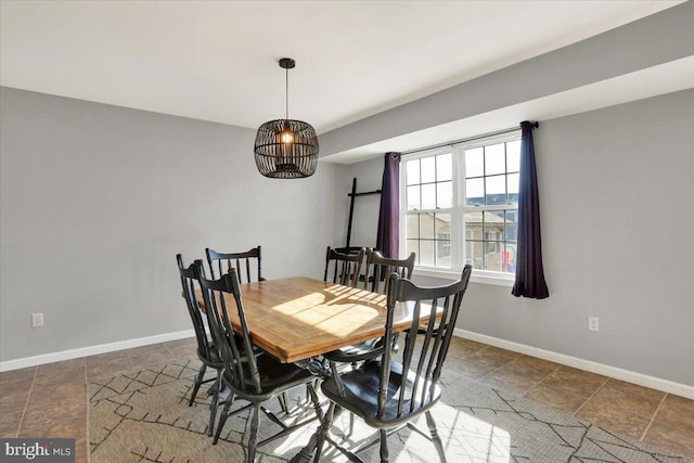 dining room with baseboards