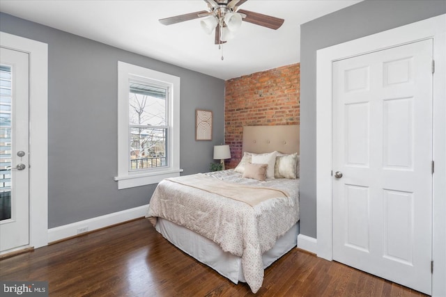 bedroom with dark wood-style floors, ceiling fan, and baseboards