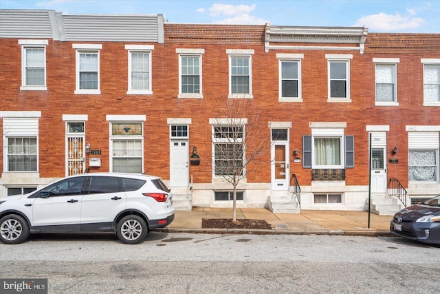 multi unit property with entry steps and brick siding