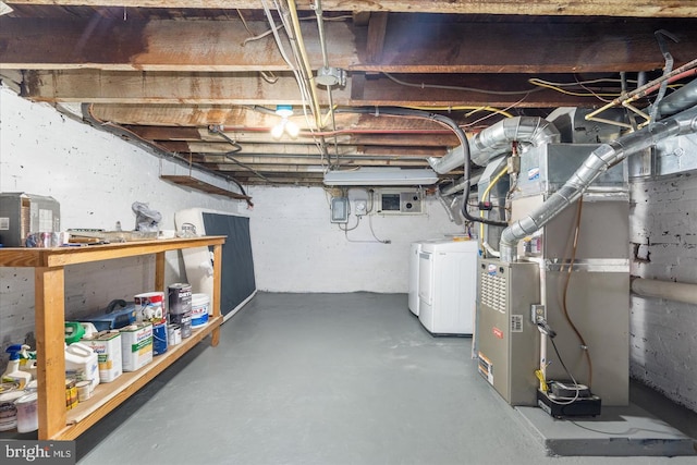 unfinished below grade area with washer / dryer and heating unit