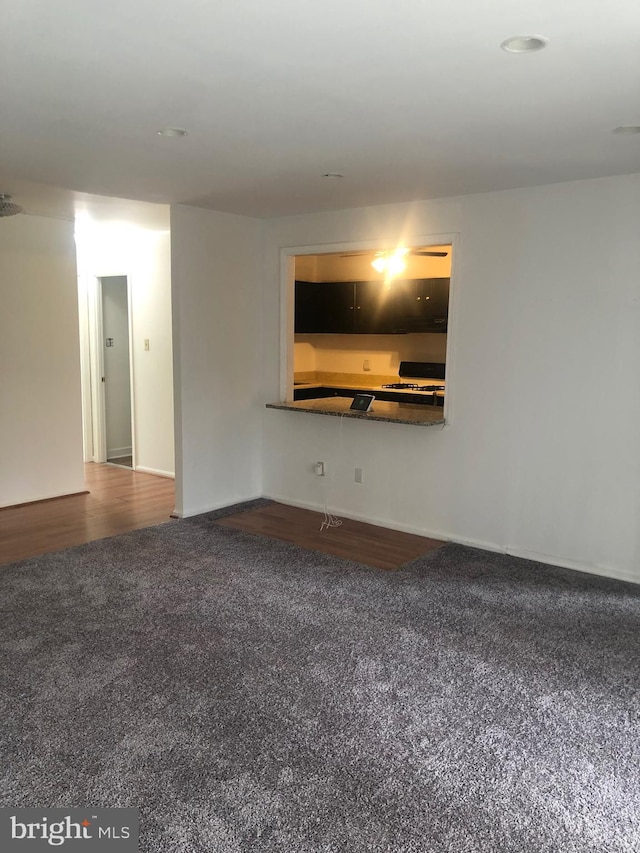 unfurnished living room featuring wood finished floors