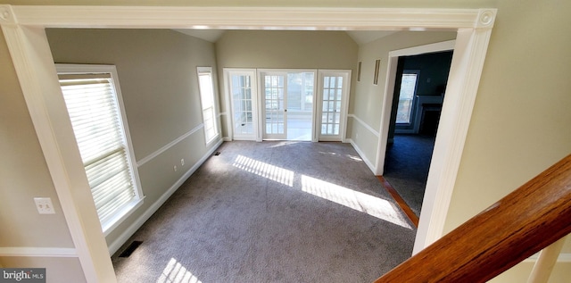 20153 Valhalla Sq, Ashburn, VA 20147 - entryway featuring carpet floors, lofted ceiling, a fireplace, and visible vents