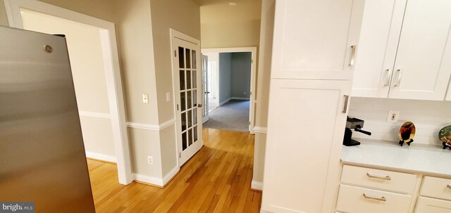 20153 Valhalla Sq, Ashburn, VA 20147 - hallway with baseboards and light wood-type flooring