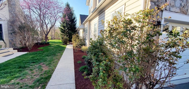 20153 Valhalla Sq, Ashburn, VA 20147 - view of home's exterior featuring a lawn