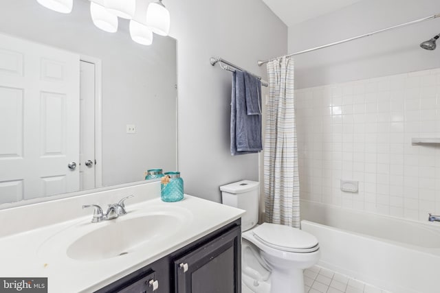 full bath with toilet, tile patterned floors, shower / bath combo, and vanity