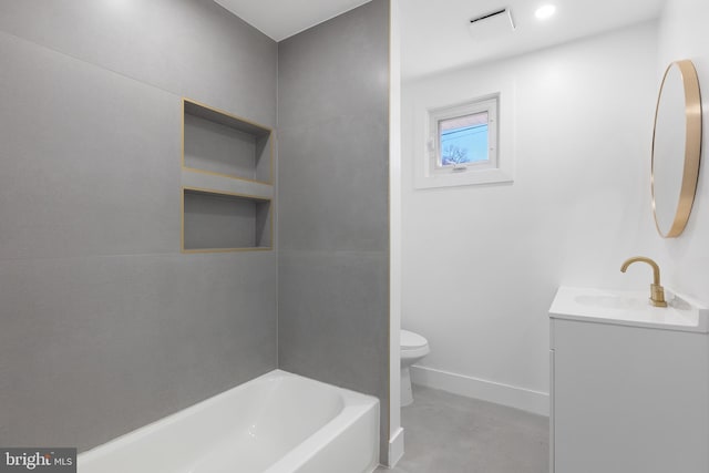 bathroom featuring toilet, vanity, and baseboards