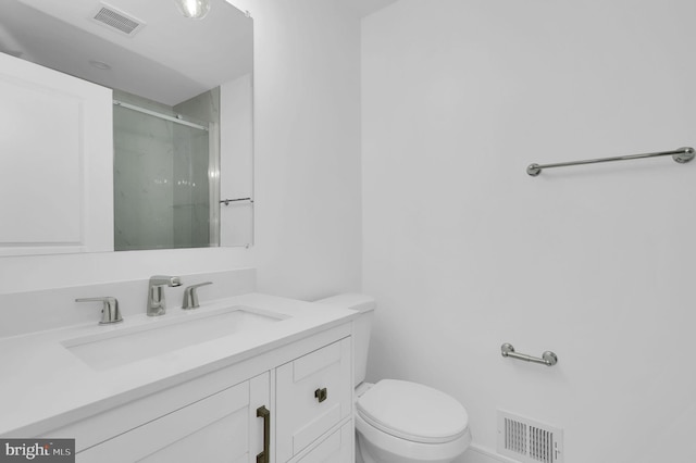 full bathroom with visible vents, a shower stall, toilet, and vanity