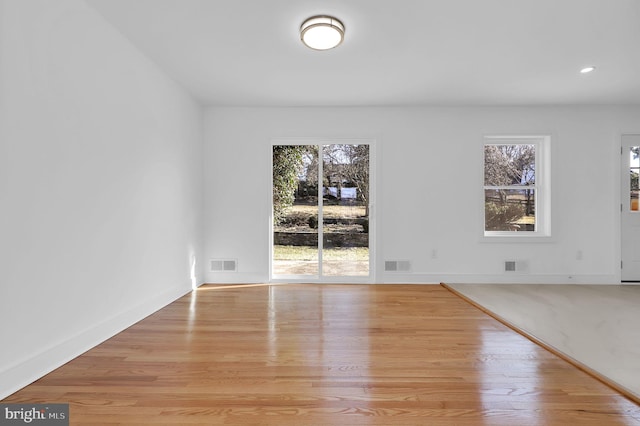 unfurnished dining area featuring recessed lighting, visible vents, and light wood-style floors