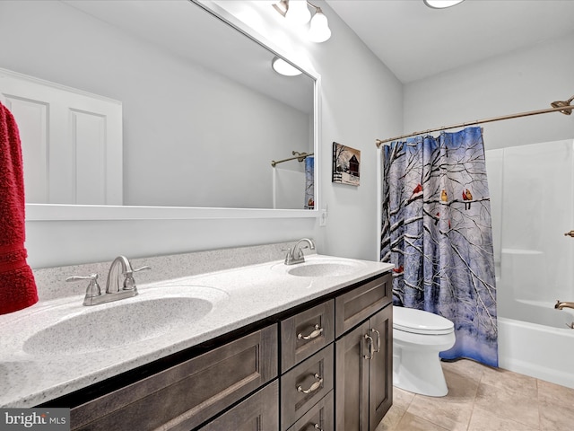 bathroom featuring shower / bath combo with shower curtain, a sink, toilet, and double vanity