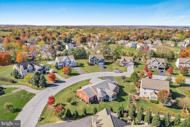 birds eye view of property with a residential view