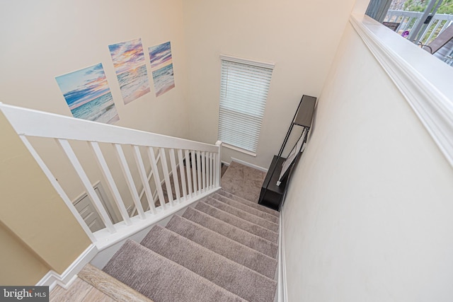 staircase featuring baseboards