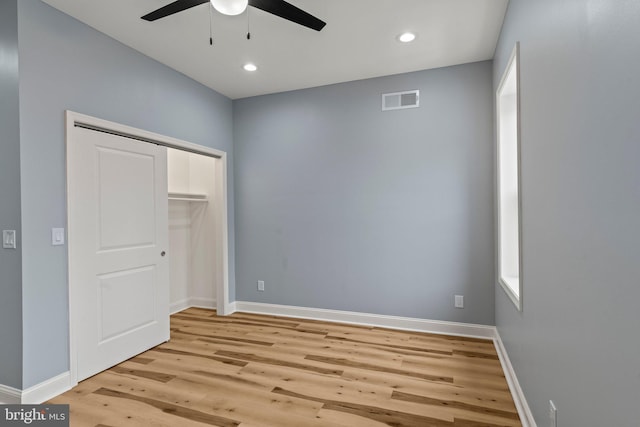 unfurnished bedroom with light wood-style floors, recessed lighting, visible vents, and baseboards