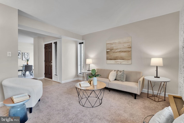 living area with carpet flooring and baseboards