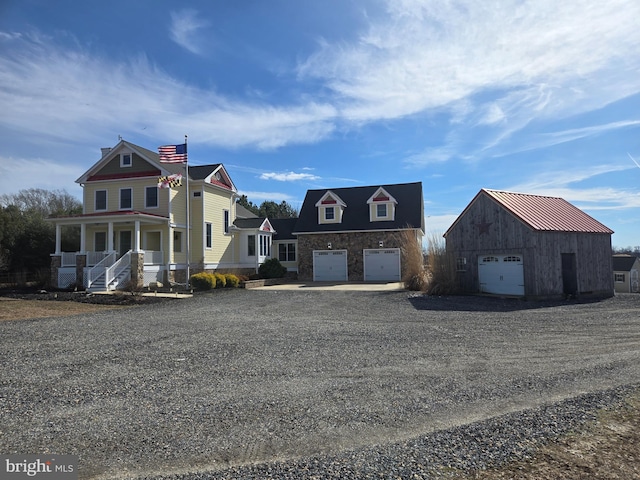 view of front facade with driveway and a porch