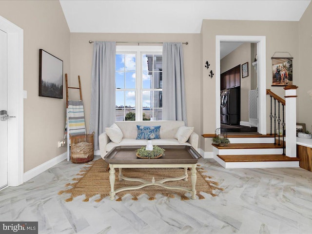 living room with stairs, marble finish floor, and baseboards