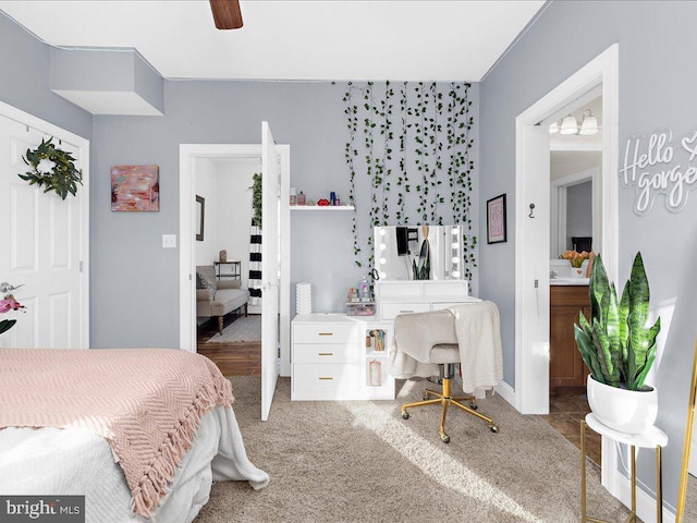 carpeted bedroom with freestanding refrigerator and ceiling fan